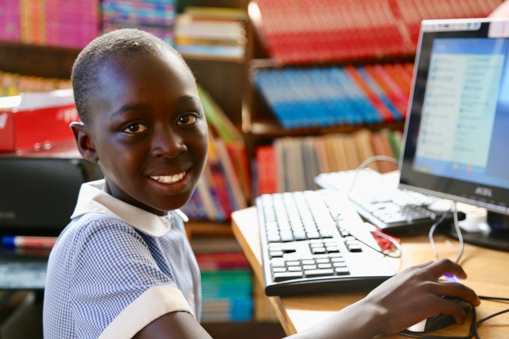 Students use laptops to learn in Rwanda